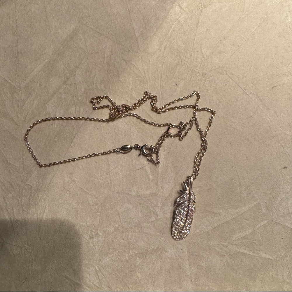Fossil gold feather long necklace